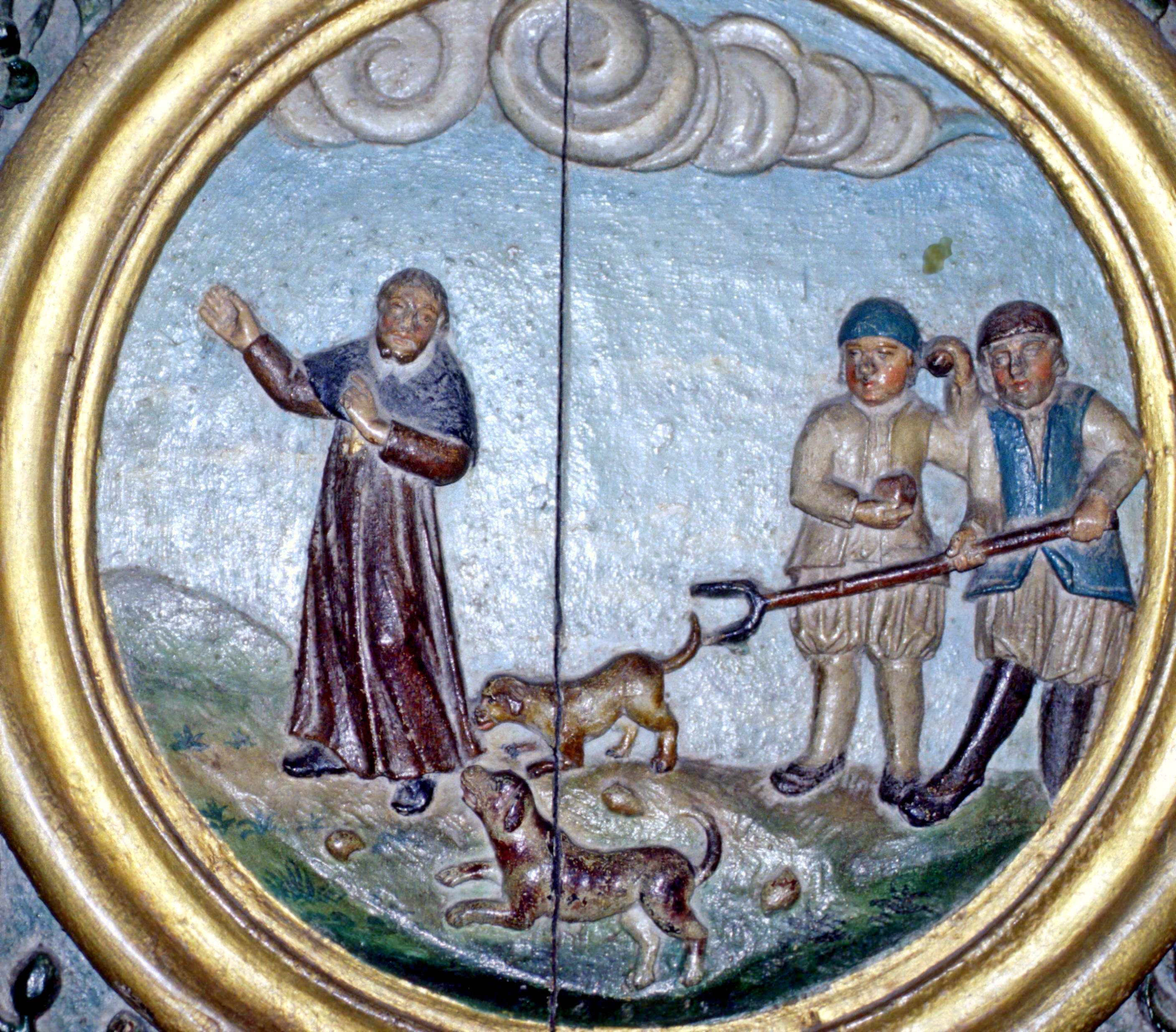 Ronan zähmt die Hunde: Dargestellt ist die legendäre Szene an der Kanzel der Kirche Saint-Ronan in Locronan, der Grabstätte des Heiligen.